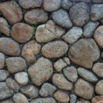 Close-up of a rustic stone wall in Medellín, displaying natural textures.