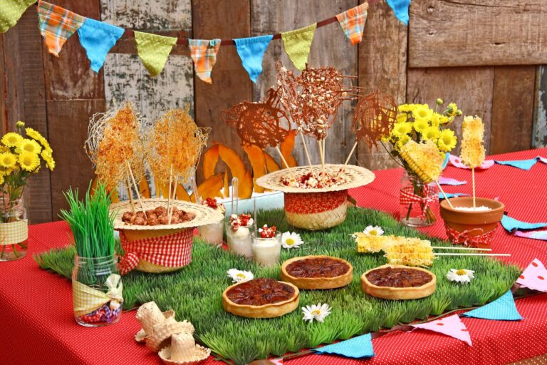 Vibrant dessert table setup with sweets and colorful decorations for a festive occasion.