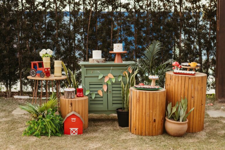 Rustic outdoor party decor with wooden elements and nature-themed props.