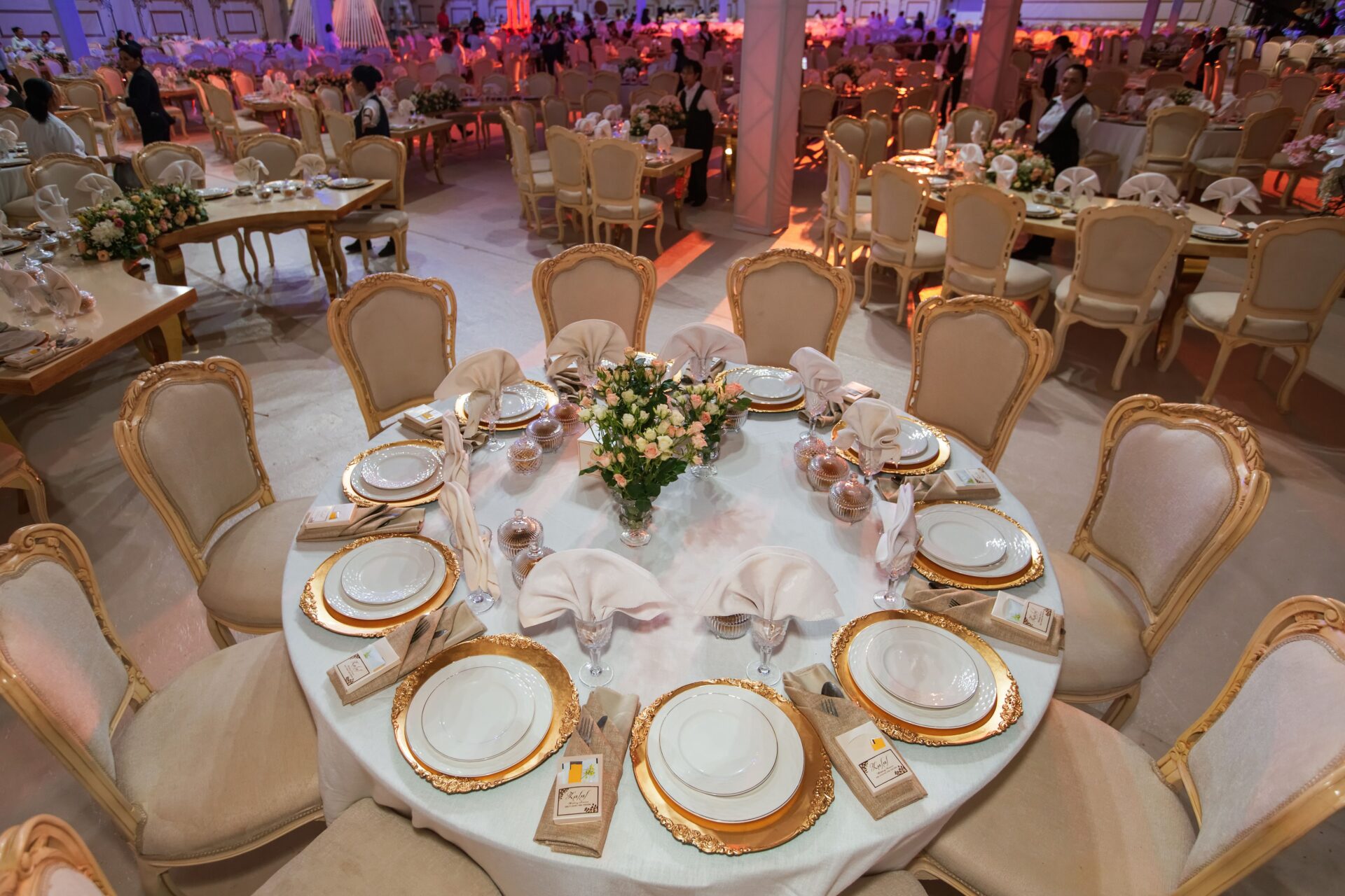 DECORATION TOOLS 3 Luxurious wedding reception with elegantly decorated tables and chairs in an opulent setting.