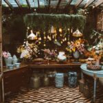 Luxurious indoor garden setting with elegant floral arrangements and ambient lighting.